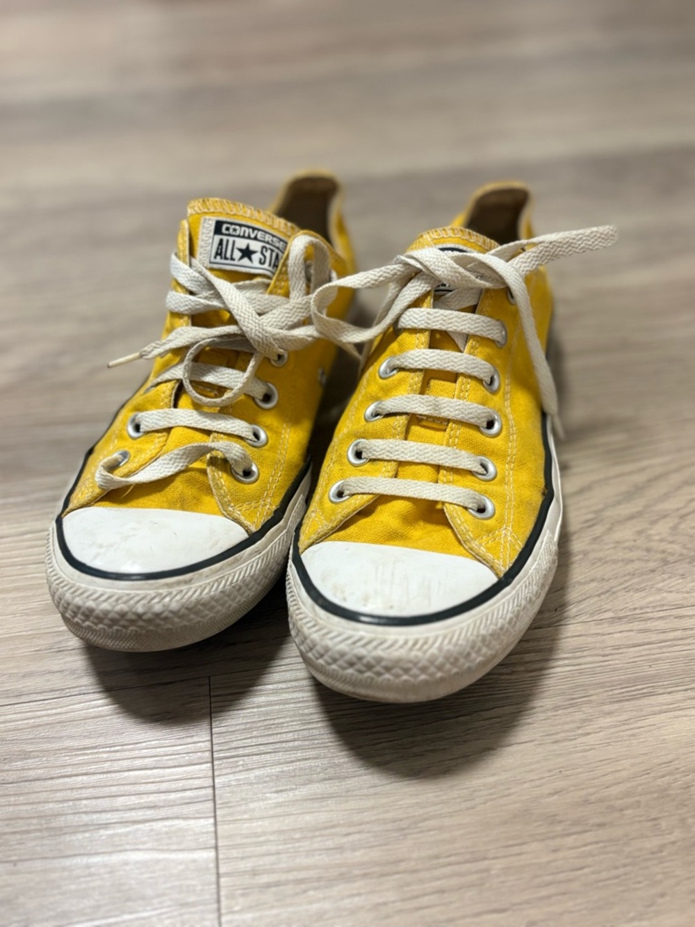 Converse Chuck Taylor All Star bright yellow sneakers with white laces